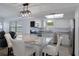 Updated kitchen featuring stainless steel appliances and a peninsula island with granite countertops at 7520 Mako Dr, Hudson, FL 34667