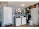 Functional laundry room with washer, dryer, shelving, and extra storage space for all your laundry needs at 7520 Mako Dr, Hudson, FL 34667