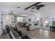 Open-concept living room flowing into the dining area, with tile floors and natural light at 7520 Mako Dr, Hudson, FL 34667