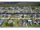 Aerial neighborhood view of canal-front homes. The houses have docks for boating and water access at 7520 Mako Dr, Hudson, FL 34667