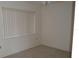 Cozy bedroom featuring neutral carpet, a window with blinds, and light walls, creating a serene atmosphere at 7600 St. Andrews Blvd # 7600, Weeki Wachee, FL 34613