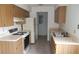 Functional kitchen with ample cabinets and appliances, offering a practical space for cooking and storage at 7600 St. Andrews Blvd # 7600, Weeki Wachee, FL 34613