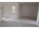 Bright living room with neutral carpet, ample windows, and a ceiling fan, creating a comfortable living space at 7600 St. Andrews Blvd # 7600, Weeki Wachee, FL 34613