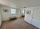Bedroom featuring a mirrored closet, carpet flooring, natural light from windows, and neutral walls at 7719 Gaston Dr, Port Richey, FL 34668