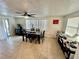 Bright dining room with tile floors and a ceiling fan at 7719 Gaston Dr, Port Richey, FL 34668