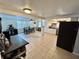 Open kitchen/dining area with tile floors and modern appliances at 7719 Gaston Dr, Port Richey, FL 34668