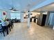 Open kitchen/dining area with tile floors, stainless steel appliances, and a view to the backyard at 7719 Gaston Dr, Port Richey, FL 34668