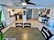 Open living space with view of kitchen, dining room and coffee bar at 7719 Gaston Dr, Port Richey, FL 34668
