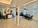 Open living space with view from dining room through kitchen to coffee bar at 7719 Gaston Dr, Port Richey, FL 34668
