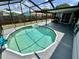Backyard showcasing a private, screened-in pool area at 7719 Gaston Dr, Port Richey, FL 34668