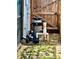 Image shows pool equipment that is outside and next to a wooden fence at 7719 Gaston Dr, Port Richey, FL 34668
