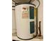 Rheem electric water heater with warning and caution labels, set up against a wall at 7719 Gaston Dr, Port Richey, FL 34668