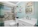 Bright bathroom with tub, shower, updated tiles and vanity at 8021 Wildflower Row, Hudson, FL 34667