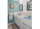 Inviting bathroom featuring dual sinks with decor that adds a touch of personality and charm at 8021 Wildflower Row, Hudson, FL 34667
