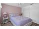 Bedroom features a window, closet and stylish bedding at 8021 Wildflower Row, Hudson, FL 34667