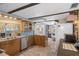 Well-equipped kitchen featuring ample counter space and cabinetry for meal preparation and storage at 8021 Wildflower Row, Hudson, FL 34667