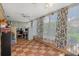 Enclosed sunroom with tile flooring and lots of natural light at 8021 Wildflower Row, Hudson, FL 34667