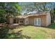 The backyard offers a peaceful retreat with a small patio accessible from the residence at 8431 Spring Hill Dr, Spring Hill, FL 34608