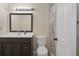Bathroom with a modern vanity, mirror, and shower with decorative tile accent at 8431 Spring Hill Dr, Spring Hill, FL 34608