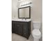 Bathroom featuring a modern vanity and fixtures, plus a toilet at 8431 Spring Hill Dr, Spring Hill, FL 34608