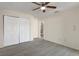 Bright bedroom featuring a ceiling fan, closet and wood-look floors at 8431 Spring Hill Dr, Spring Hill, FL 34608