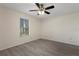 Bright bedroom featuring a ceiling fan, window and wood-look floors at 8431 Spring Hill Dr, Spring Hill, FL 34608