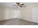 Bright bedroom featuring a ceiling fan, closet and wood-look floors at 8431 Spring Hill Dr, Spring Hill, FL 34608