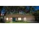 Charming single-story home featuring a well-maintained lawn and a covered front porch entrance at 8431 Spring Hill Dr, Spring Hill, FL 34608