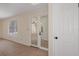 Living room with tile floors, a sliding glass door, and a door to a closet at 8431 Spring Hill Dr, Spring Hill, FL 34608