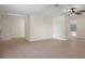 Expansive living room featuring tile flooring, neutral walls, and a ceiling fan for added comfort at 8431 Spring Hill Dr, Spring Hill, FL 34608