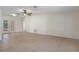 Open concept living space with tile floors and natural lighting, great for entertaining at 8431 Spring Hill Dr, Spring Hill, FL 34608