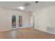 Open living area with easy access to the backyard, accented with a decorative archway at 8431 Spring Hill Dr, Spring Hill, FL 34608