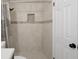 Shower showcasing decorative accent tile and tiled shower niche at 8431 Spring Hill Dr, Spring Hill, FL 34608