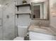 Modern bathroom featuring a granite vanity, marble tiled shower, and updated fixtures at 9111 Greenbriar Ln, Port Richey, FL 34668