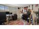 Cozy bedroom featuring a variety of guitars, music equipment and a multi-colored area rug at 9111 Greenbriar Ln, Port Richey, FL 34668