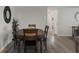 This dining room has wood floors and neutral-colored walls and trim at 9111 Greenbriar Ln, Port Richey, FL 34668