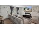 Living room boasts modern decor, a large sectional sofa, and media setup for entertaining at 9111 Greenbriar Ln, Port Richey, FL 34668