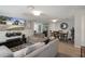 Open living space with a dining area, modern decor, and seamless flow for entertaining at 9111 Greenbriar Ln, Port Richey, FL 34668