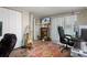 Home office featuring a guitar, desk, and media setup, with natural light from a large window at 9111 Greenbriar Ln, Port Richey, FL 34668