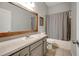 Bathroom featuring a vanity with a large mirror, a toilet, and a shower with a curtain at 9527 Southern Charm Cir, Brooksville, FL 34613