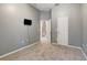 Neutral bedroom featuring its neutral color scheme and carpet at 9527 Southern Charm Cir, Brooksville, FL 34613
