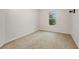 Neutral bedroom featuring a bright window, and neutral carpeting at 9527 Southern Charm Cir, Brooksville, FL 34613