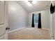 Neutral bedroom featuring a window for natural light and neutral carpet at 9527 Southern Charm Cir, Brooksville, FL 34613