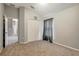 Bedroom featuring gray window treatments and closet doors for storage solutions at 9527 Southern Charm Cir, Brooksville, FL 34613