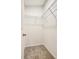 Walk-in closet providing organized storage via built in, wire shelving at 9527 Southern Charm Cir, Brooksville, FL 34613