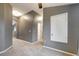 Hallway featuring neutral walls, carpeted floors, and an open view to another room at 9527 Southern Charm Cir, Brooksville, FL 34613