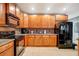 Modern kitchen features granite countertops and stainless appliances at 9527 Southern Charm Cir, Brooksville, FL 34613