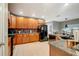 Modern kitchen features granite countertops and wood cabinets at 9527 Southern Charm Cir, Brooksville, FL 34613