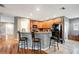 Kitchen with breakfast bar, wood cabinets, and black appliances at 9527 Southern Charm Cir, Brooksville, FL 34613