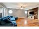 Living room with wood accent wall and blue sectional sofa at 9527 Southern Charm Cir, Brooksville, FL 34613